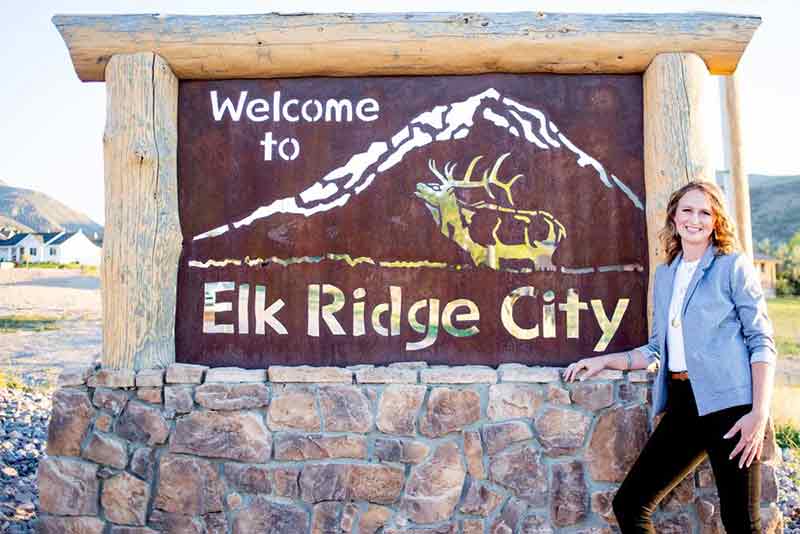 Tanya Willis in front of Elk Ridge community